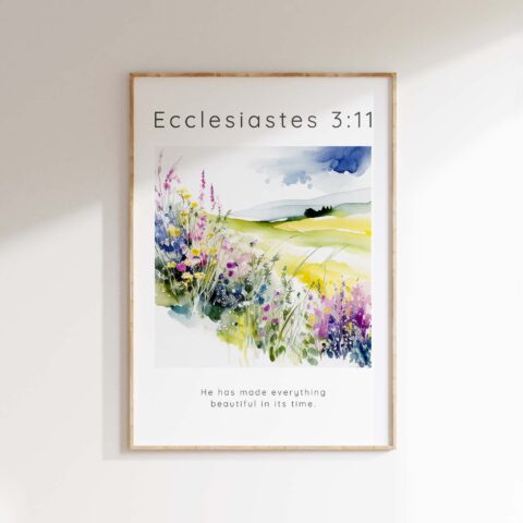 A Bible verse print featuring a flower meadow with Ecclesiastes 3:11.